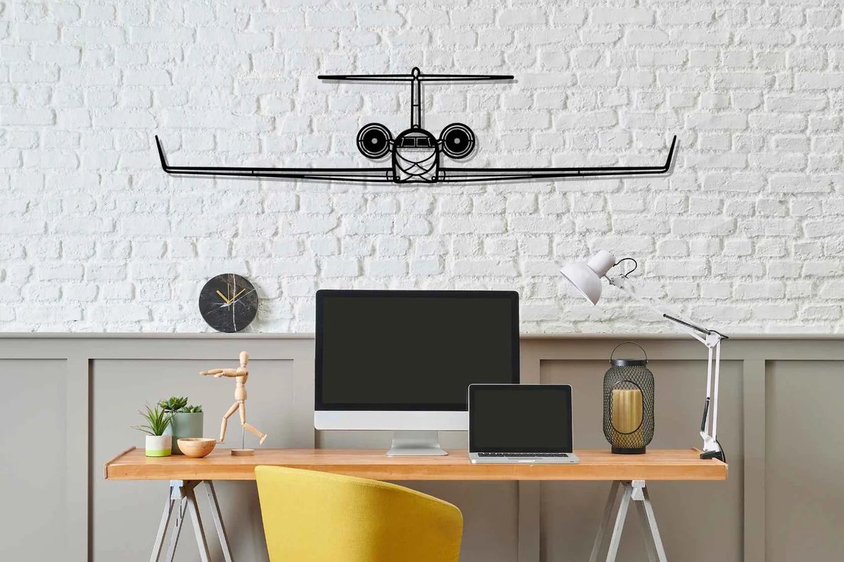 Aircraft wall art: G650 front silhouette black metal wall art above a home office desk on a white brick wall