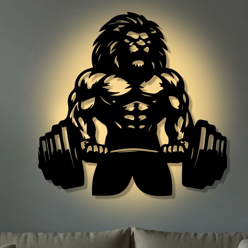Gym wall art: Lion Workout black metal wall art glowing with LED backlight on a grey wall