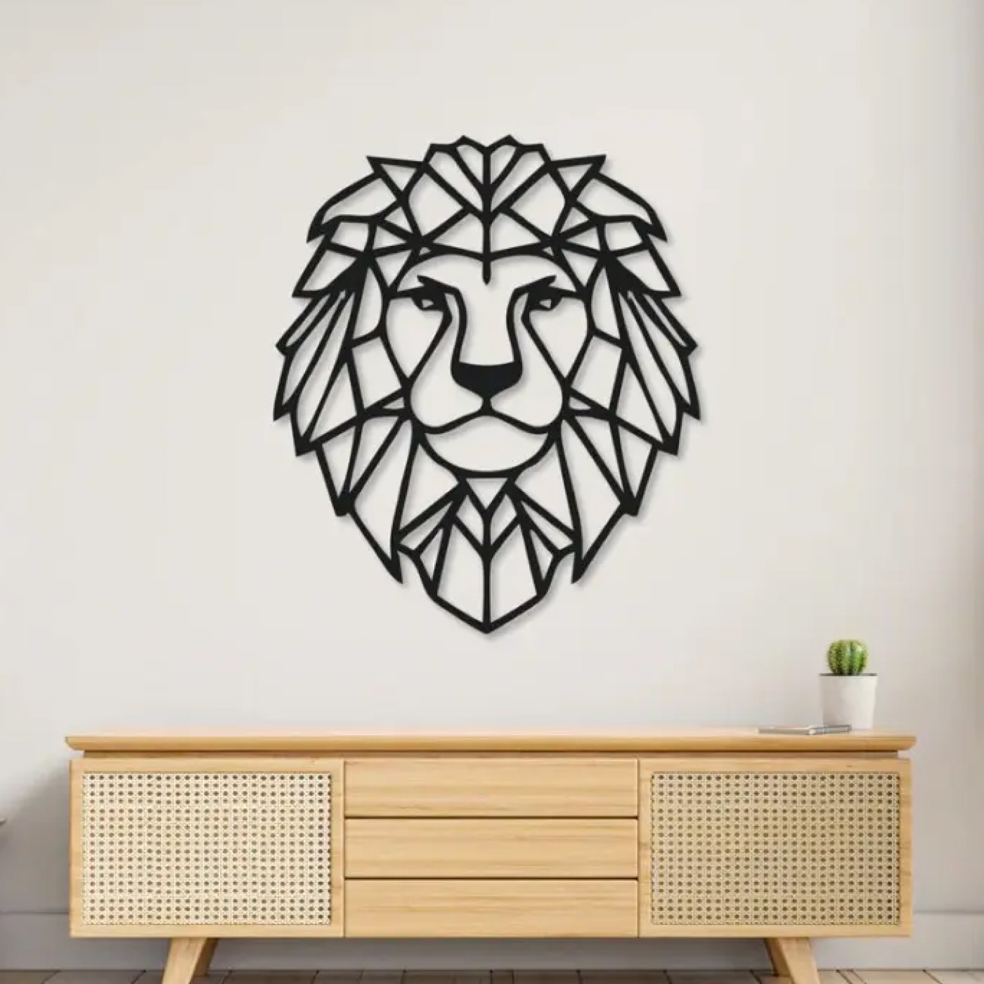 Animals wall art: geometric lion metal silhouette mounted above a wooden console in a modern living room