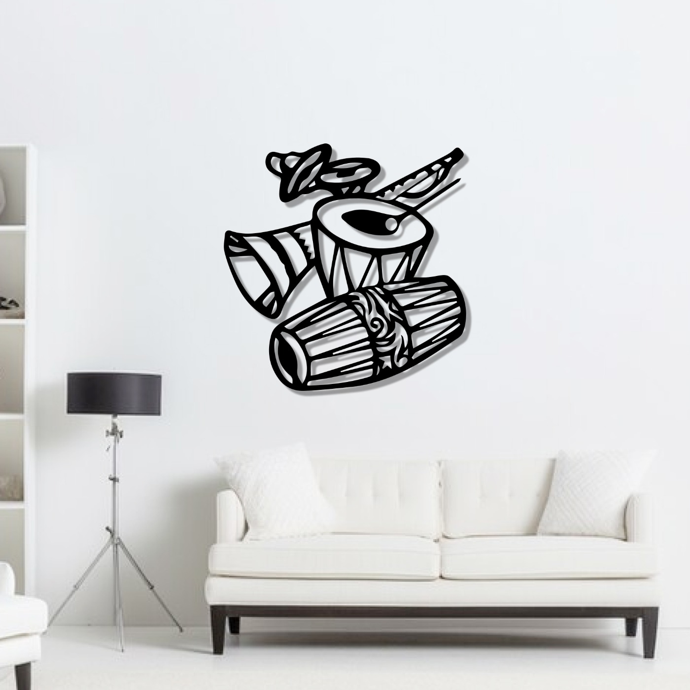 Music wall art: tabla and drum laser-cut metal design mounted above a white sofa in a bright living room