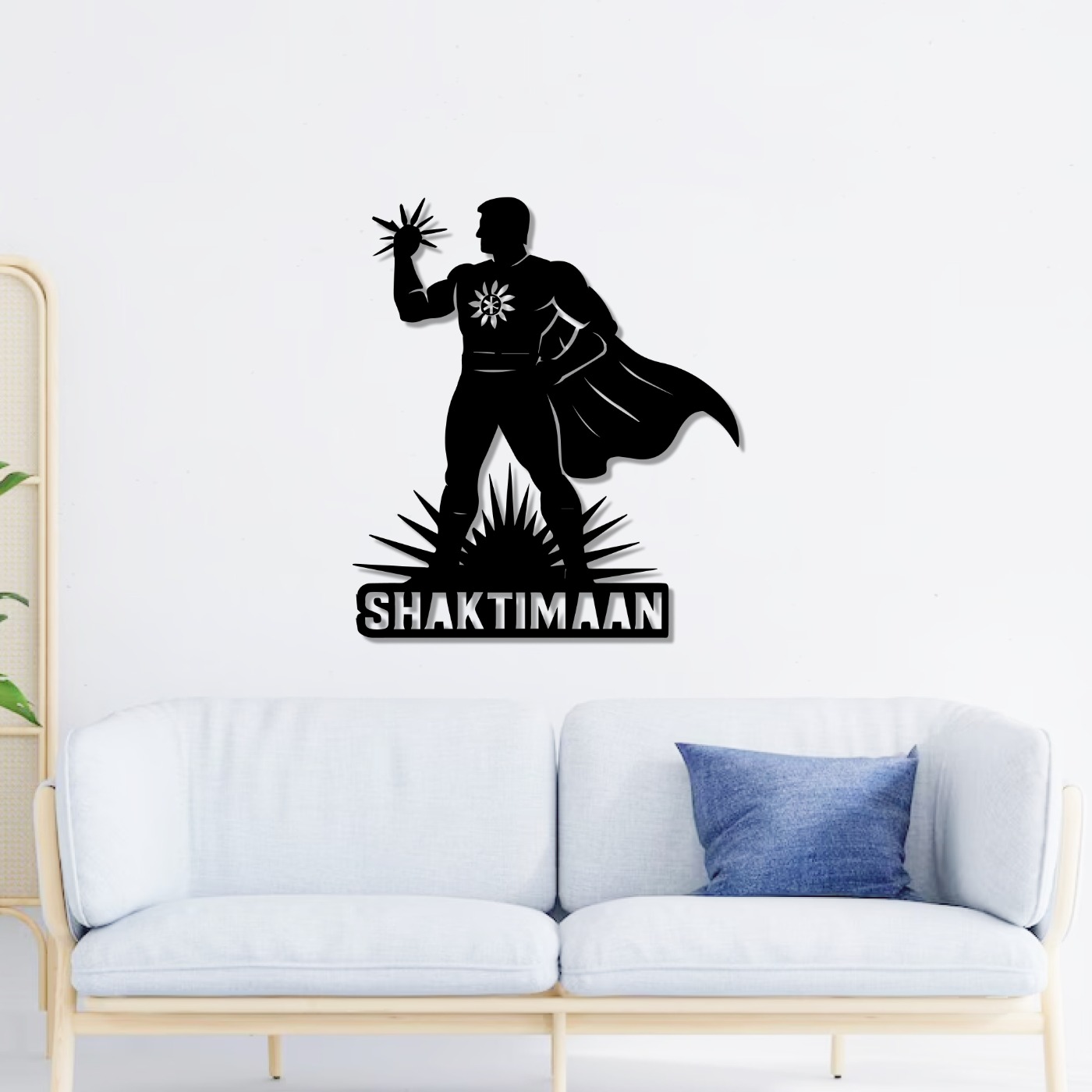 Superhero wall art: Shaktimaan laser-cut metal design mounted above a white sofa in a bright living room