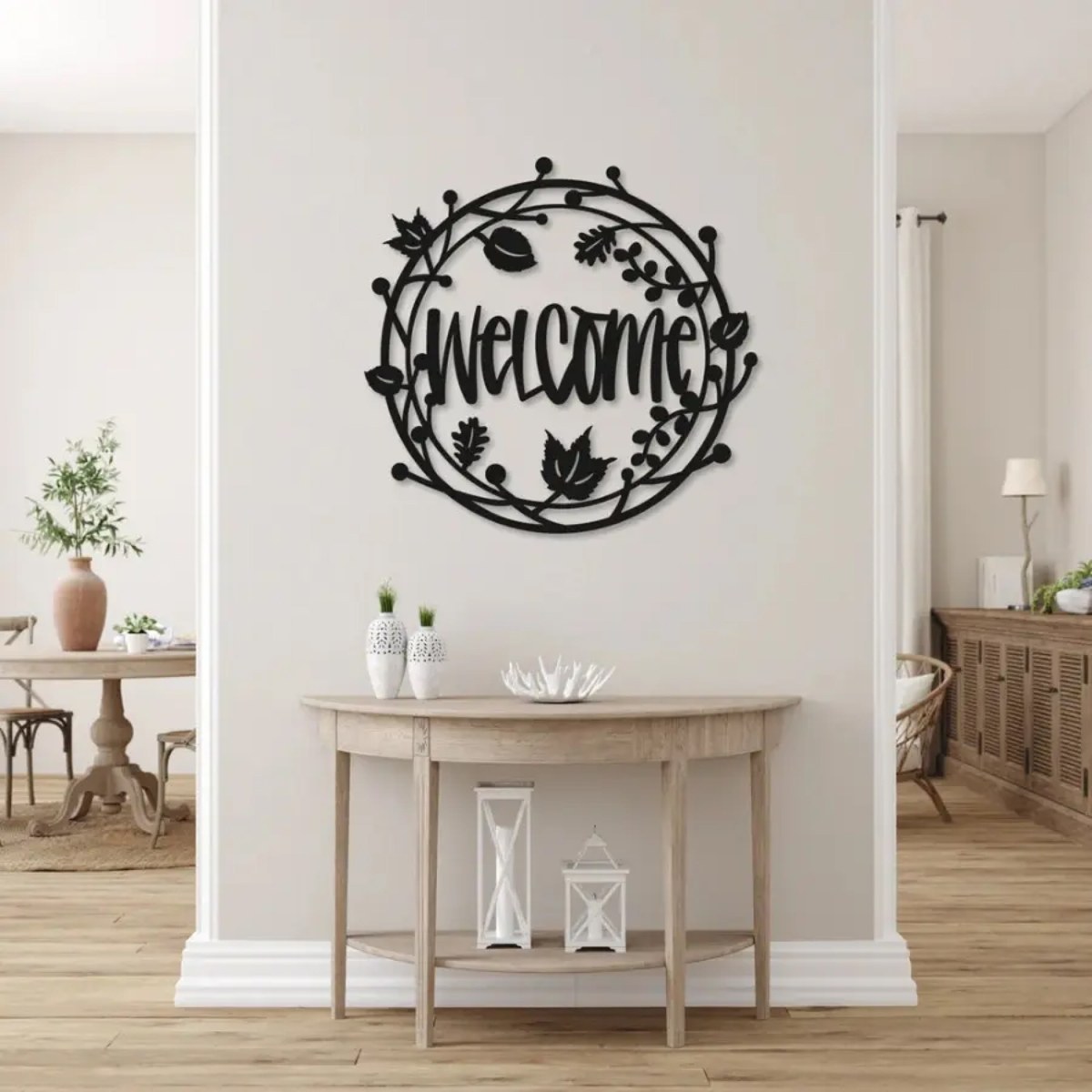 Metal wall art gifts: Welcome Floral laser-cut black steel wall art above an entryway console table
