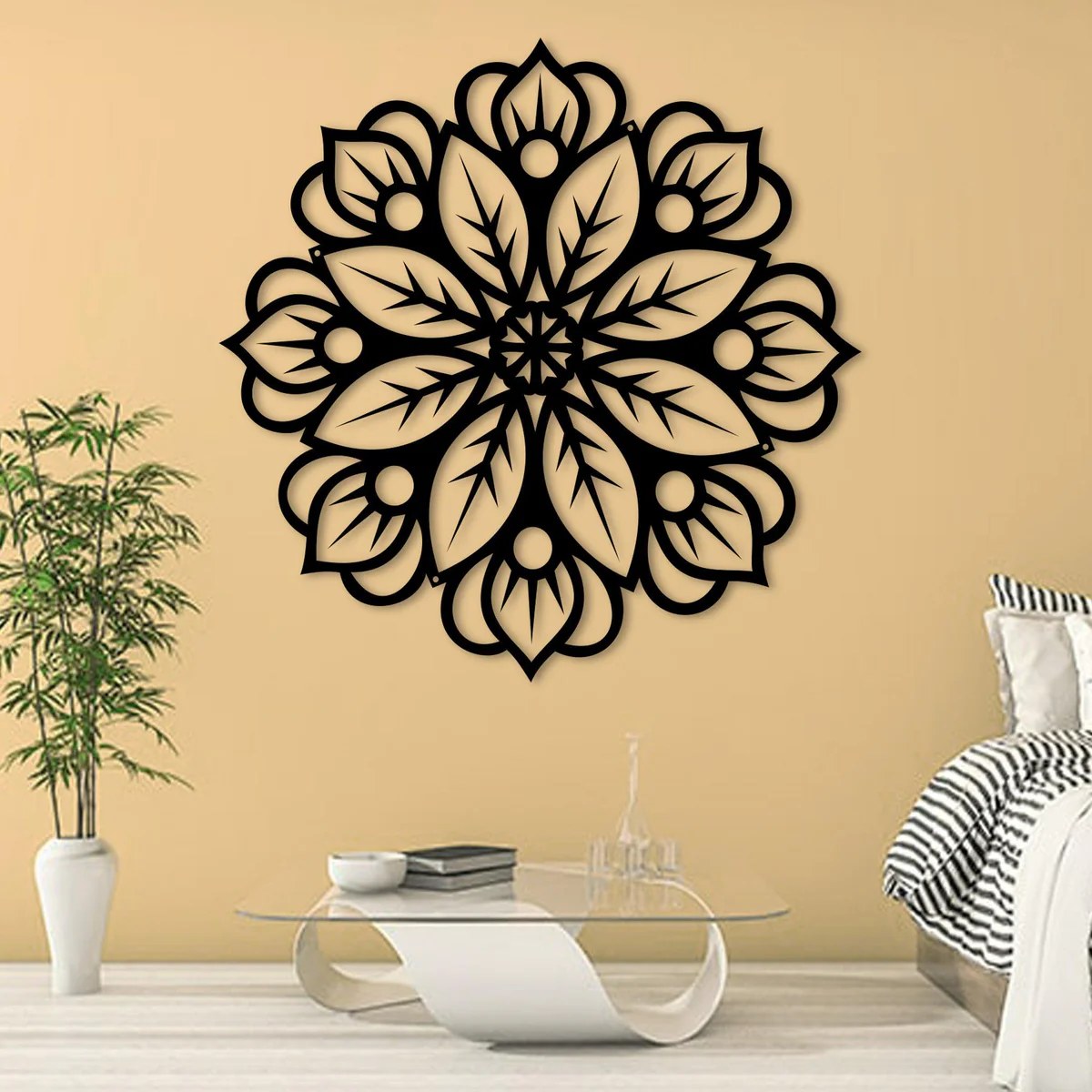 Metal wall art for bedroom: black laser-cut Floral Mandala steel wall art on a warm peach wall beside a bed