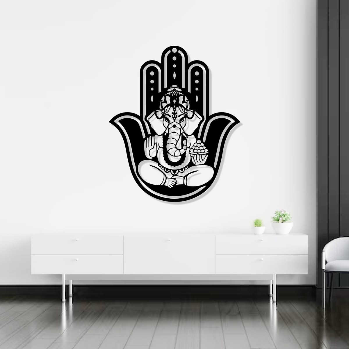 Ganesha wall art: black laser-cut Divine Hamsa Ganesha steel wall art above a white console