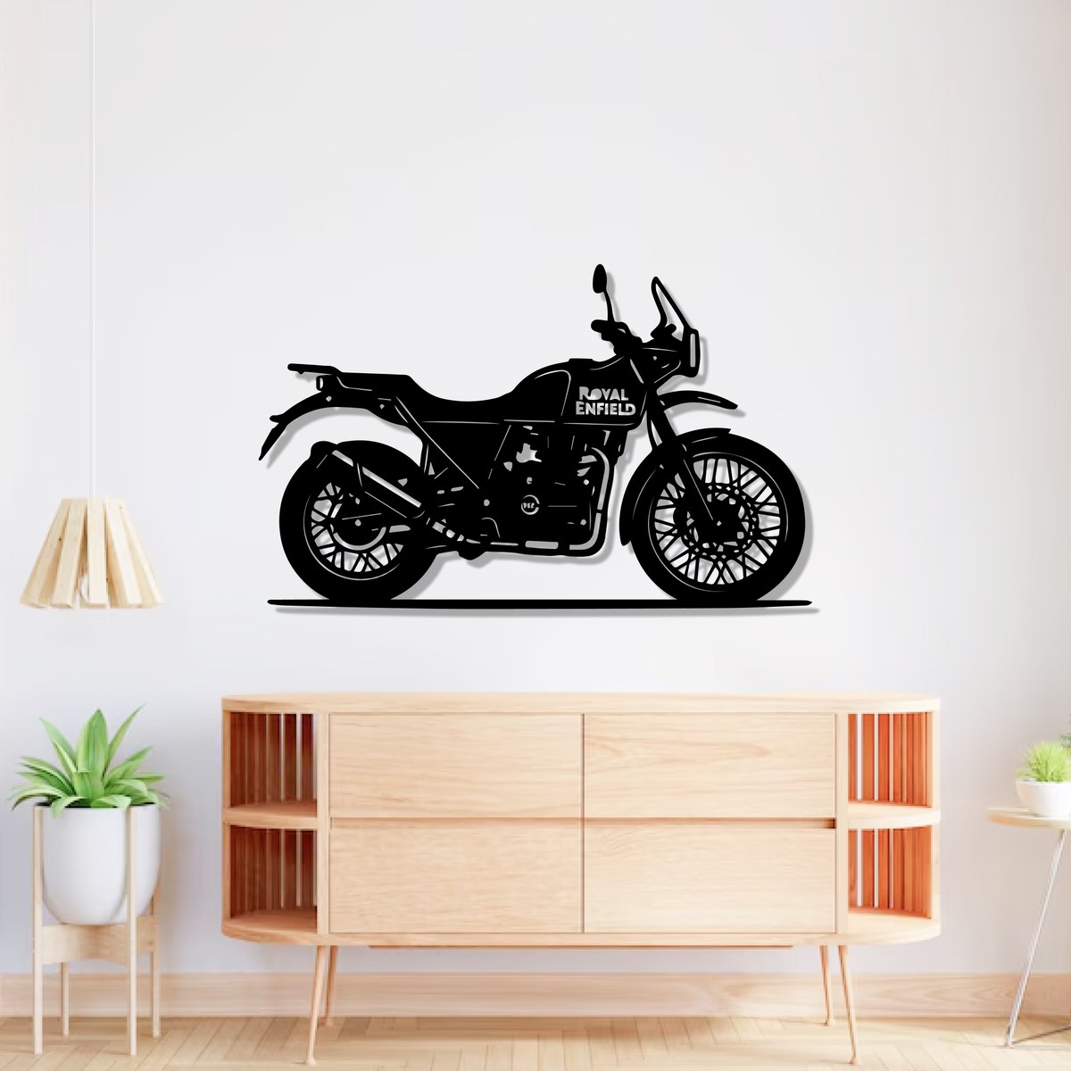 Royal Enfield wall art: black laser-cut Himalayan 411 steel silhouette above a wooden console