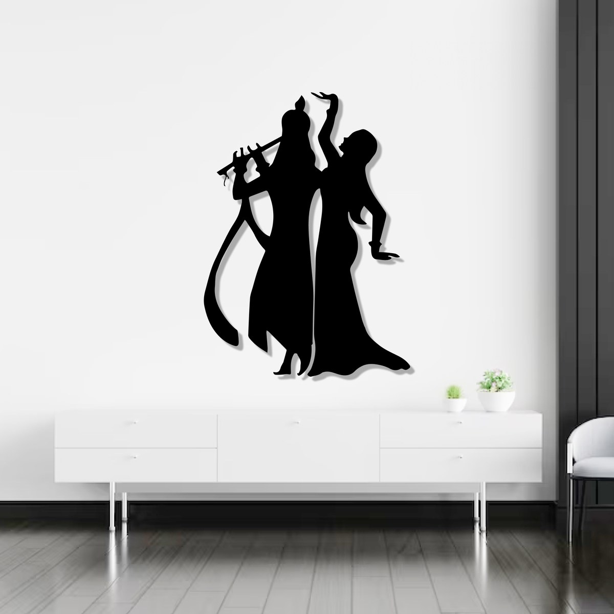 Krishna wall art: black laser-cut Radha Krishna steel silhouette above a white console
