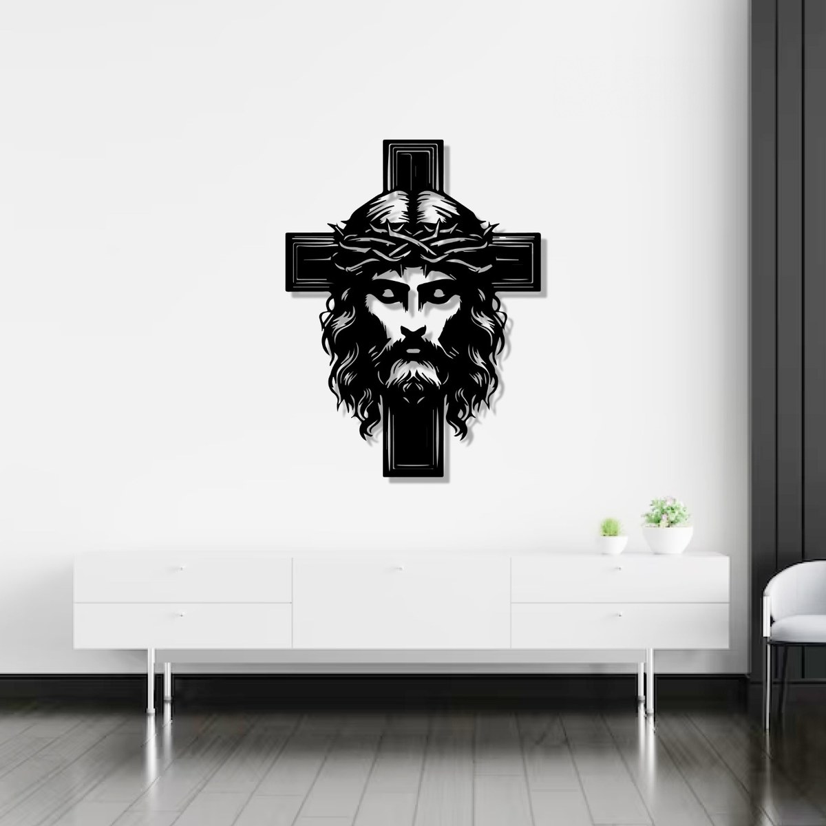Jesus wall art: black laser-cut metal Jesus with cross above a white sideboard
