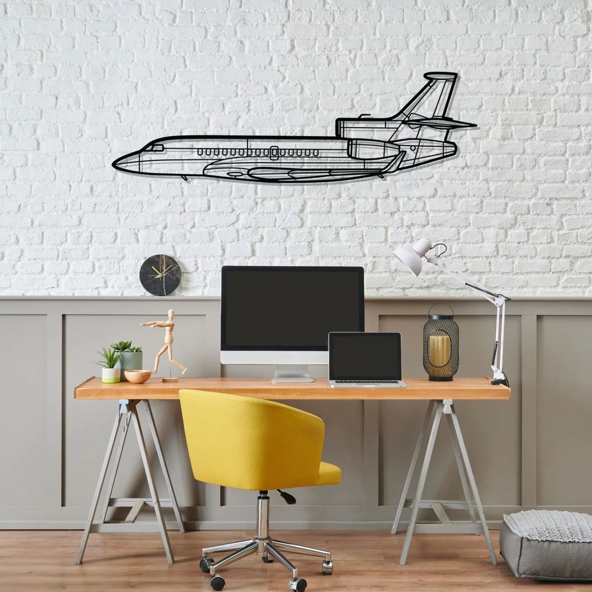 Private jet wall art: black laser-cut Falcon 7X silhouette metal wall art above a home office desk