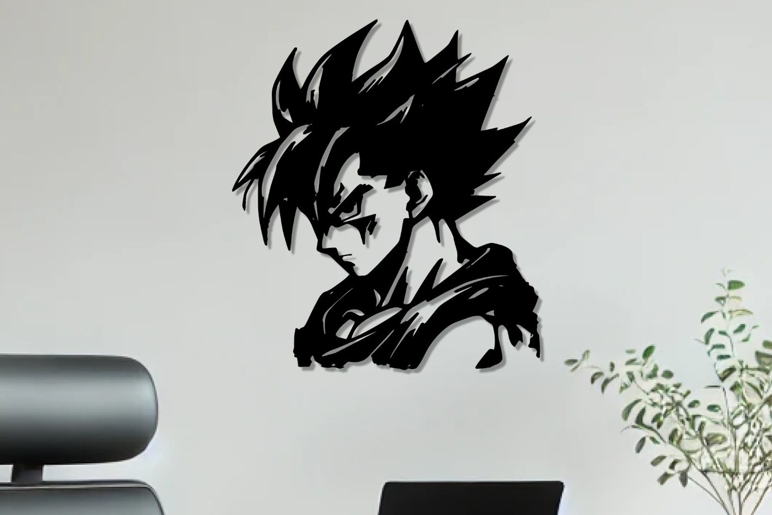 Super Saiyan Goku anime wall art in black metal above a home office desk