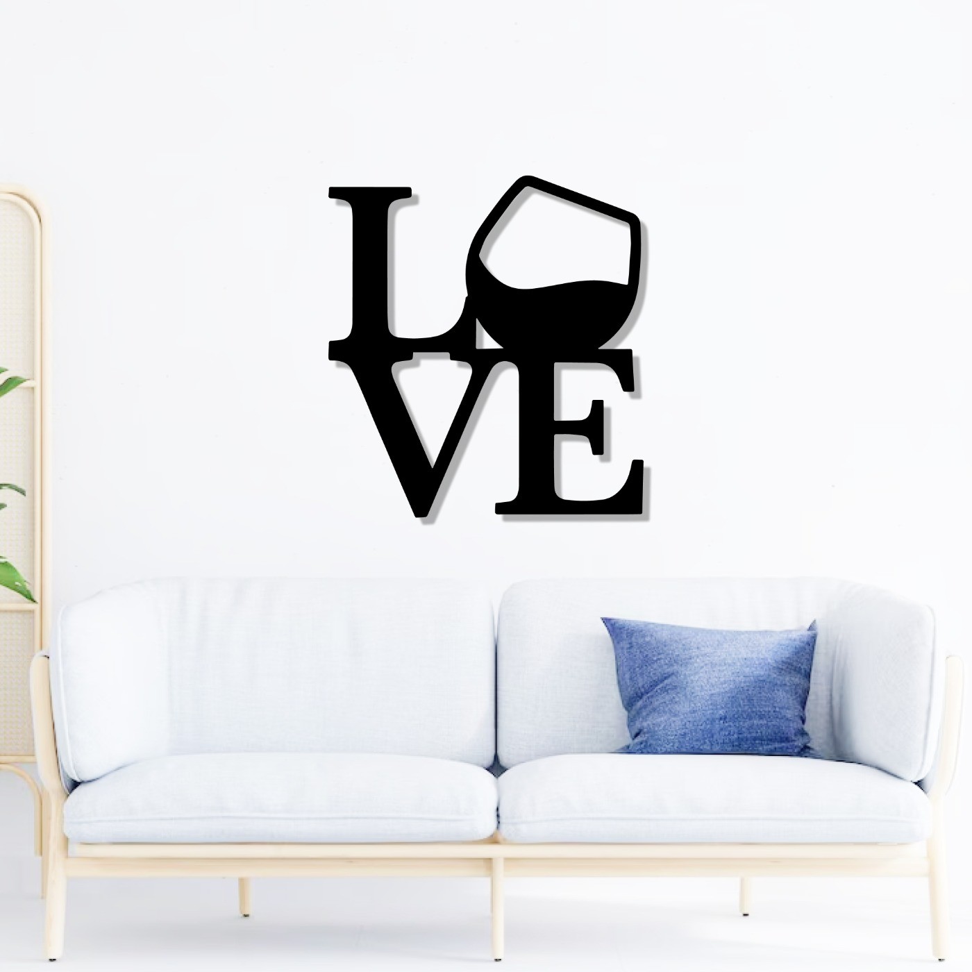 Love Wine wall art in black metal above a white sofa