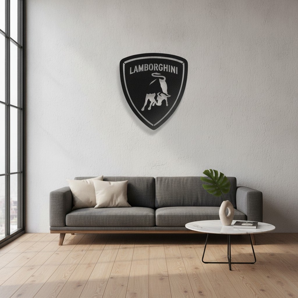 Lamborghini car emblem wall art above a grey sofa in a bright living room