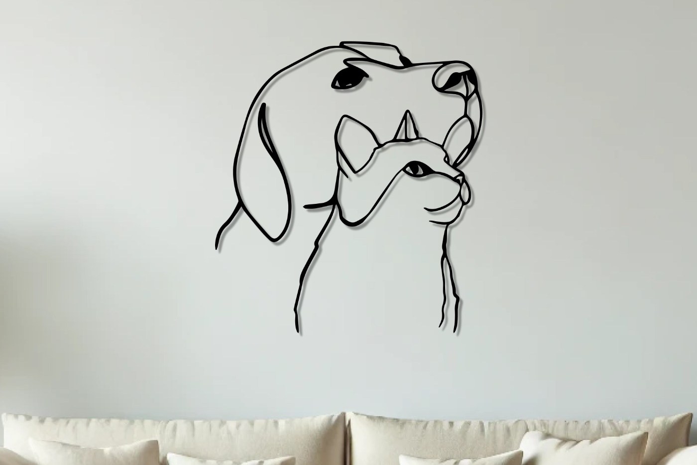 Cat and dog line art metal wall art above a beige sofa